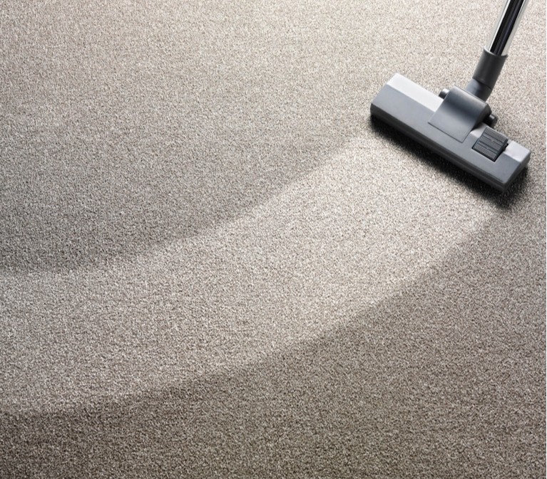 Vacuum cleaner on carpet | Allied Flooring & Paint