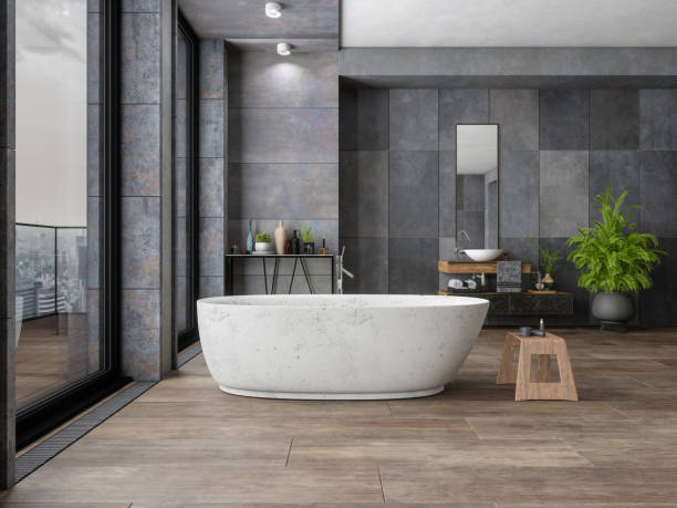 Bathroom tile dark flooring with bath tub | Allied Flooring & Paint